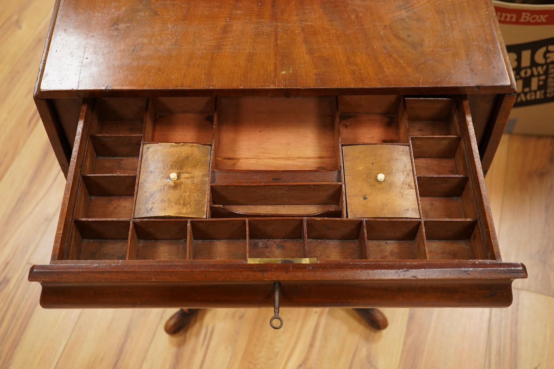 A mid 19th century mahogany pedestal Pembroke table, with inset brass plaque engraved; ‘Presented to Qtr. Master Sgt. Ed. Rainey by his Comrades the Officers, Non-Commissioned Officers and Privates of the 7th Company Lin